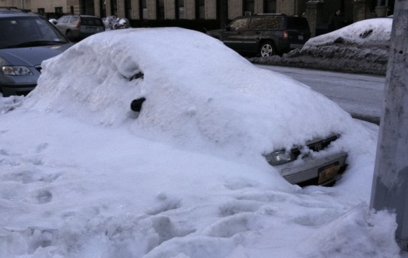 Car buried in snowbank in New York